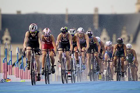 Athletes compete during the bike leg